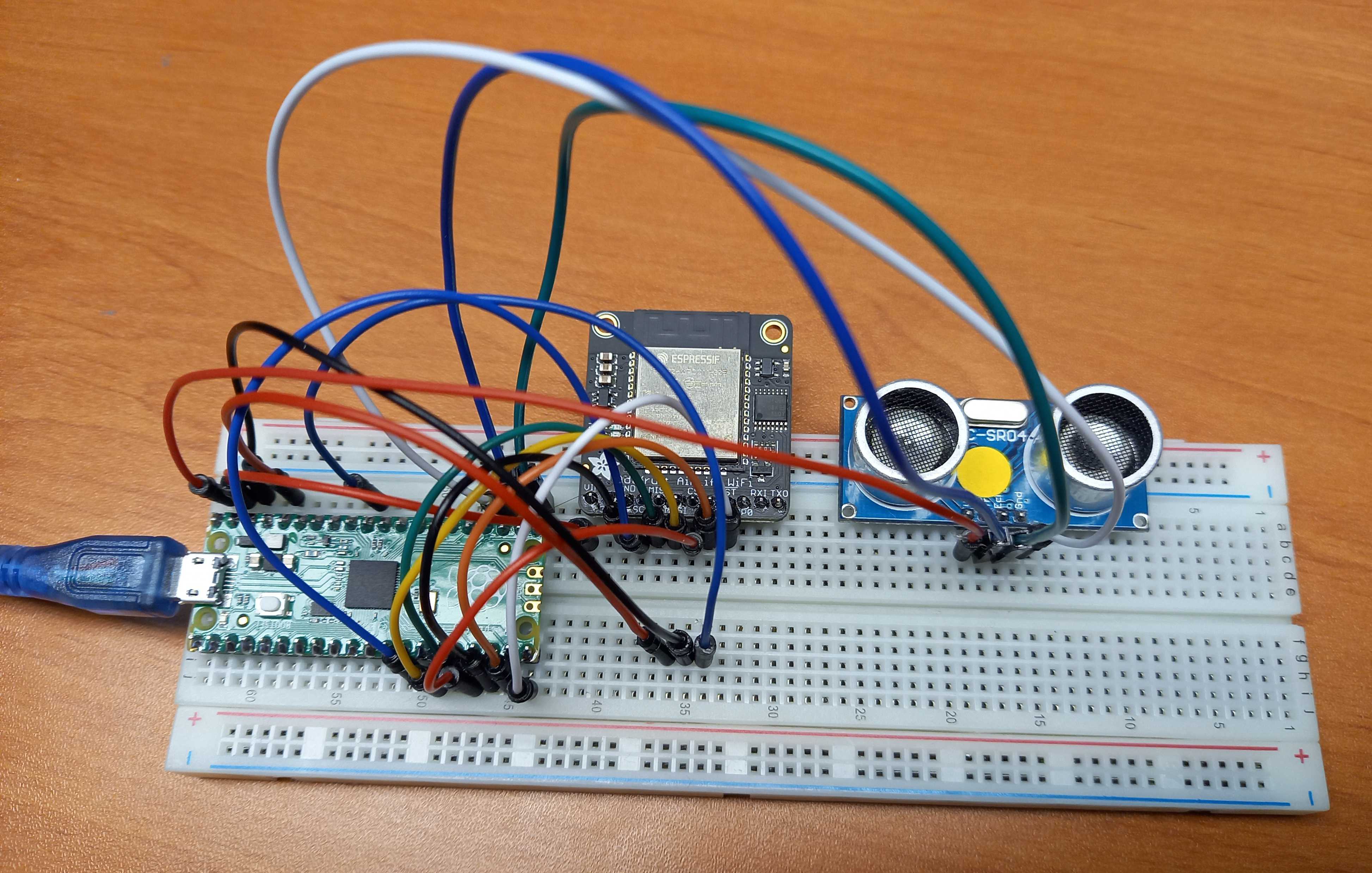 Breadboard wiring with Raspberry Pi Pico, Adafruit AirLift and distance sensor