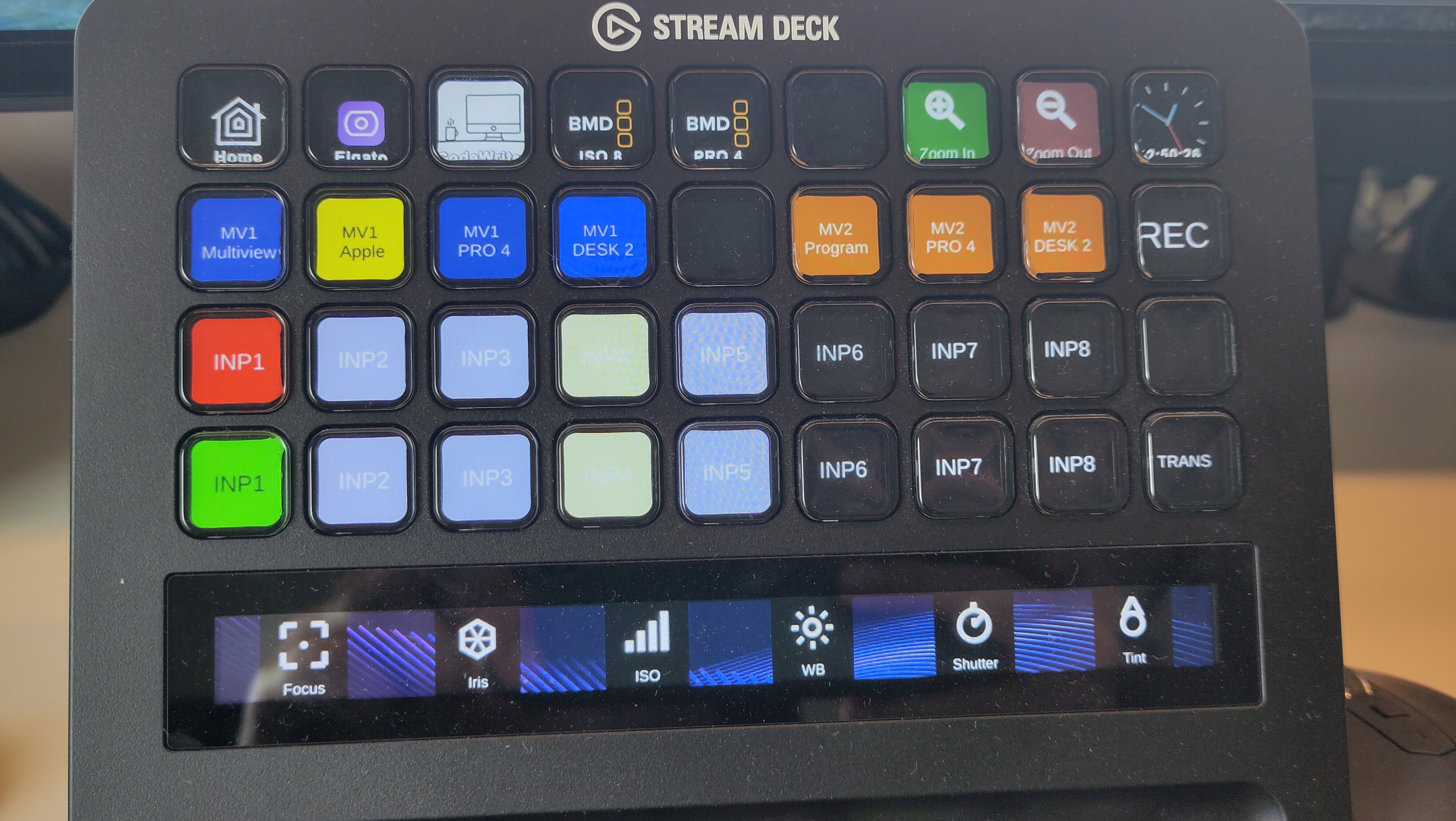 The Stream Deck XL with Bitfocus Companion: input selection and multiview presets on the buttons, and focus, iris, ISO, white balance, shutter and tint of the camera on the dials